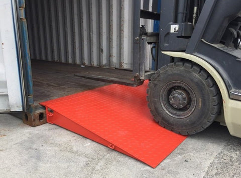 Overview of container ramp connected to 40ft sea container in warehouse