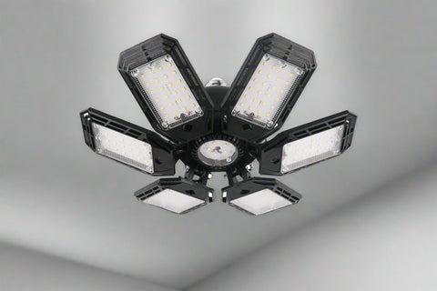 Foldable LED ceiling lights with multi-angle illumination in garage