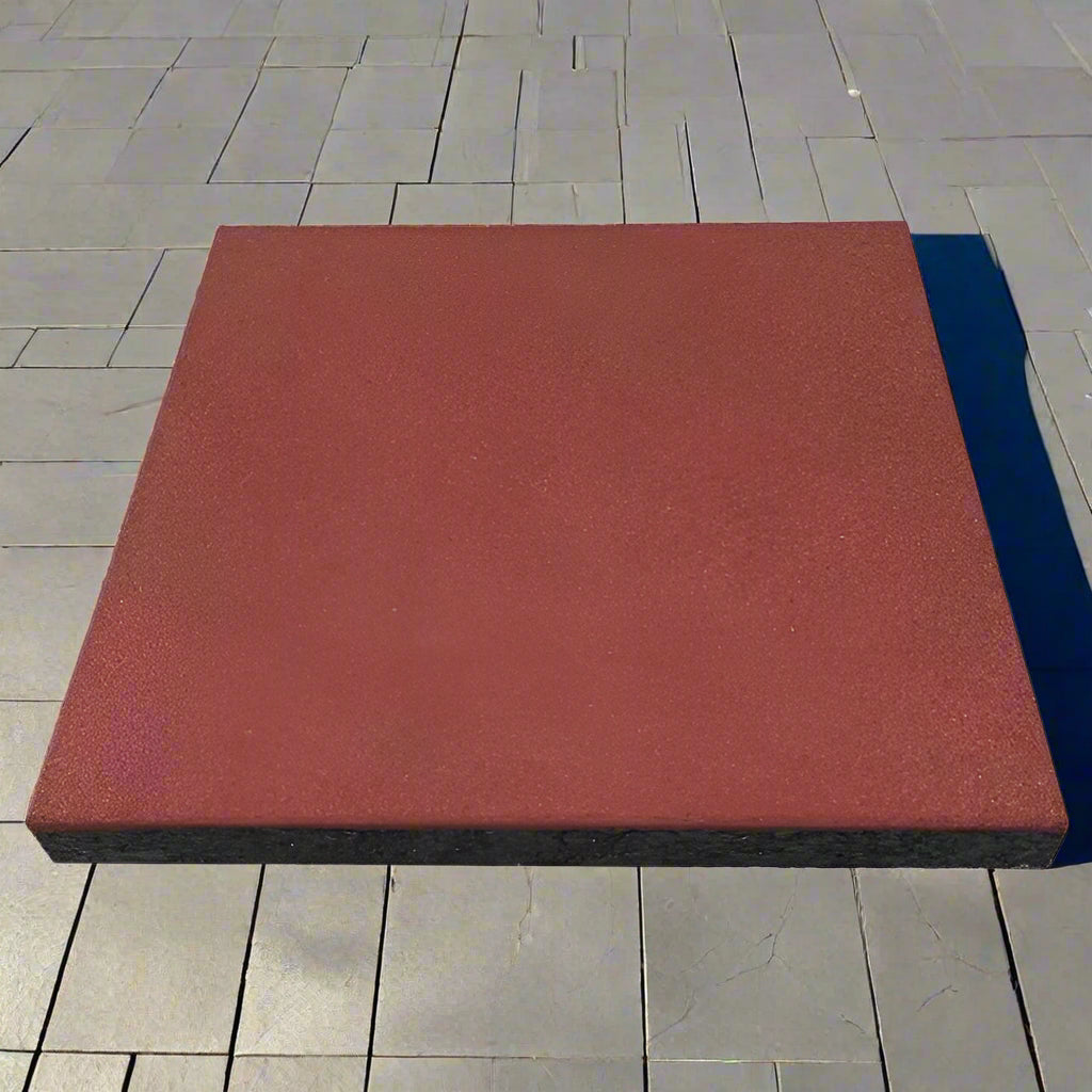 Interlocking red rubber patio tile close-up
20x20 rubber tile stacked set – top view
Playground flooring tile – angled corner
Red rubber tiles for outdoor use
Rubber tile texture – slip-resistant surface