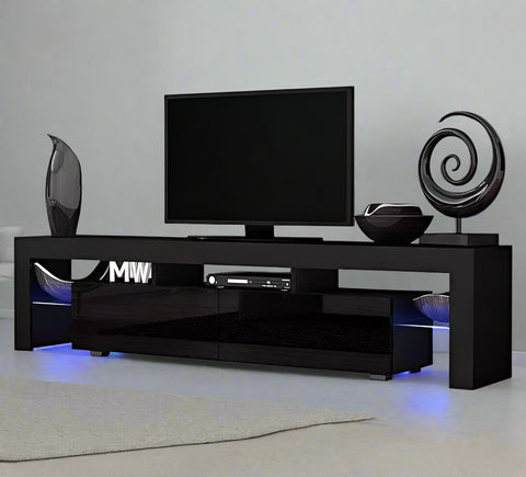 Modern RGB LED TV stand with lights under flat-screen TV
Black gloss entertainment unit with RGB lights in living room
White TV console with open shelving and LED lighting
Stylish high gloss media cabinet with mood lighting
Contemporary entertainment center for 75 inch TVs