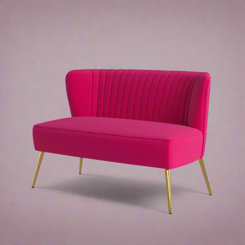 Fuchsia velvet loveseat with tufted back and gold legs in modern decor.
Ivory armless loveseat sofa with mid-century design in studio setup.
Tan velvet 2-seater with flared gold legs styled against a neutral wall.
Close-up of plush velvet texture and fluted backrest detail.
Color swatches displaying Fuchsia, Pink, Ivory, and Tan options.