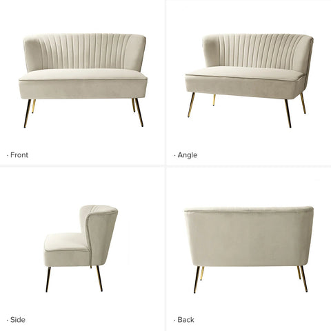 Fuchsia velvet loveseat with tufted back and gold legs in modern decor.
Ivory armless loveseat sofa with mid-century design in studio setup.
Tan velvet 2-seater with flared gold legs styled against a neutral wall.
Close-up of plush velvet texture and fluted backrest detail.
Color swatches displaying Fuchsia, Pink, Ivory, and Tan options.