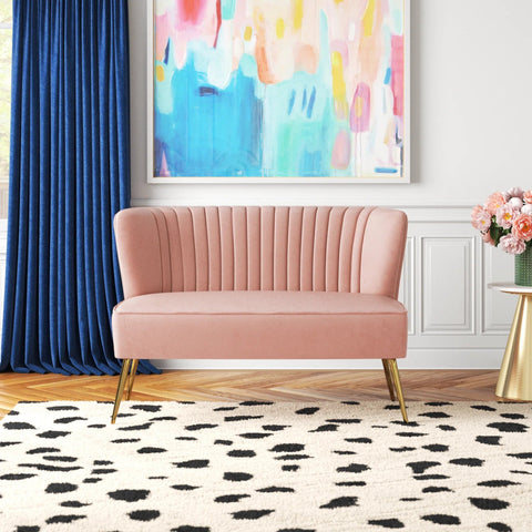 Fuchsia velvet loveseat with tufted back and gold legs in modern decor.
Ivory armless loveseat sofa with mid-century design in studio setup.
Tan velvet 2-seater with flared gold legs styled against a neutral wall.
Close-up of plush velvet texture and fluted backrest detail.
Color swatches displaying Fuchsia, Pink, Ivory, and Tan options.