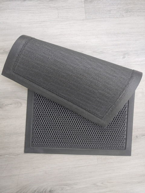 Heavy-duty 2x3 FT dirt catcher mat on light wood floor
Non-slip rubber backing for entry mat safety
Rolled-up doormat showing thickness and texture
Close-up of dirt-trapping texture on entry mat