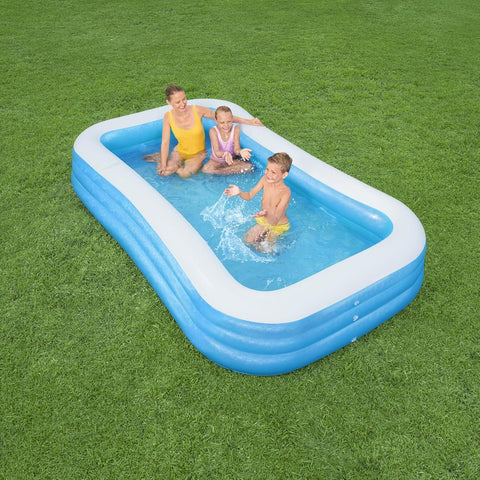 Bestway inflatable rectangular paddling pool with family inside
Top-down view of Bestway blue inflatable pool
Inflatable pool on grass with children playing
Side angle of Bestway pool showing two air chambers
Dimensions of Bestway family pool
Family enjoying inflatable pool in the backyard
Rectangular Bestway paddling pool setup outdoors