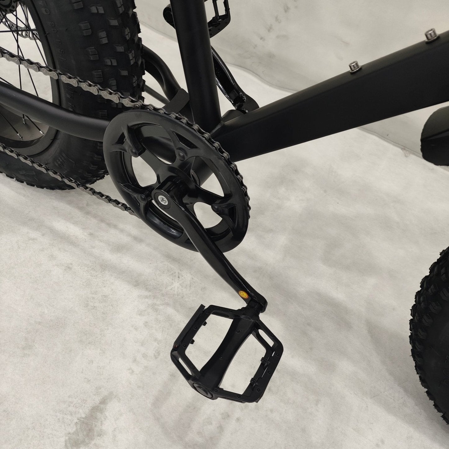 Deviant 20-inch fat tire off-road bike on the beach
Side view of 7-speed fat tire bike with disc brakes
Shimano derailleur on Deviant fat tire bike
Close-up of front disc brake and suspension fork
All-season fat tire bike on snow and gravel terrain