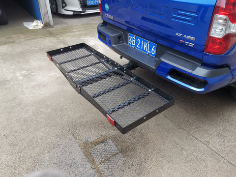 Mounted hitch cargo basket on truck for carrying travel and camping gear