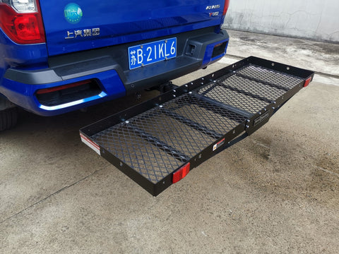 Folded hitch cargo carrier attached to 2-inch receiver for easy storage