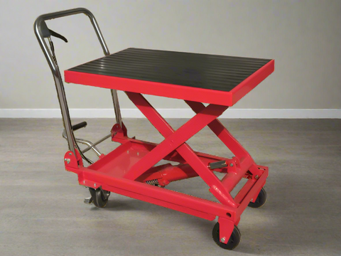 Side view of heavy-duty red scissor lift table cart with steel frame and platform