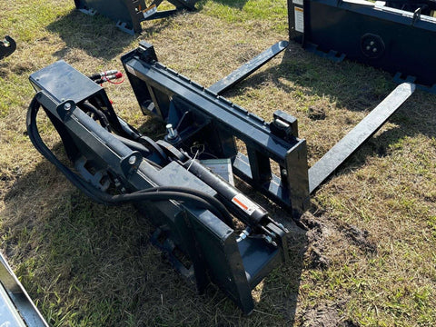 Rotating hydraulic skid steer pallet fork with 42” tines
HRB11172A attachment showing 127° rotation
Heavy-duty quick attach pallet forks for skid steer
Close-up of reinforced steel fork frame
Rotating fork in lifted pallet position on gravel site