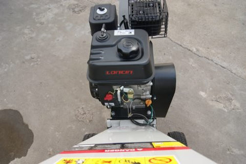 15 HP Kohler electric start wood chipper – trailer mounted front view
Side profile of 420cc wood chipper with hitch and tires
Chipper machine close-up showing large intake chute and rotor
Kohler engine wood chipper parked outdoors with debris