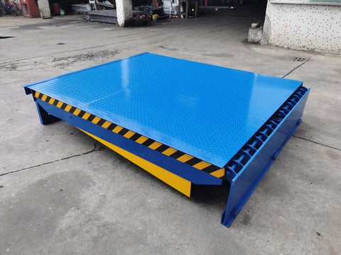 Electric dock leveler ramp with blue powder-coated finish