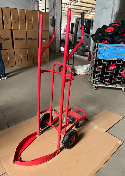 Red tire trolley cart with pneumatic wheels in garage
Heavy-duty tire dolly lifting tire set, ergonomic grip detail, welded frame close-up, tire stack in transit