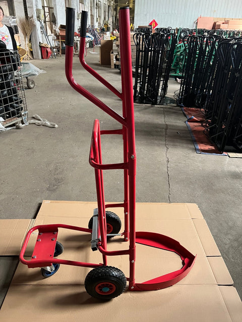 Red tire trolley cart with pneumatic wheels in garage
Heavy-duty tire dolly lifting tire set, ergonomic grip detail, welded frame close-up, tire stack in transit