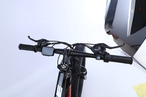 26 inch electric fat tire e-bike with 500W motor and disc brakes
Side view of black all-terrain e-bike with oversized tires
Removable 48V lithium battery on mountain fat tire e-bike
Close-up of rear hub motor and gear system on electric bike
Electric trail bike designed for snow, sand, and rugged terrain
Urban and off-road ready fat tire e-bike with aluminum frame