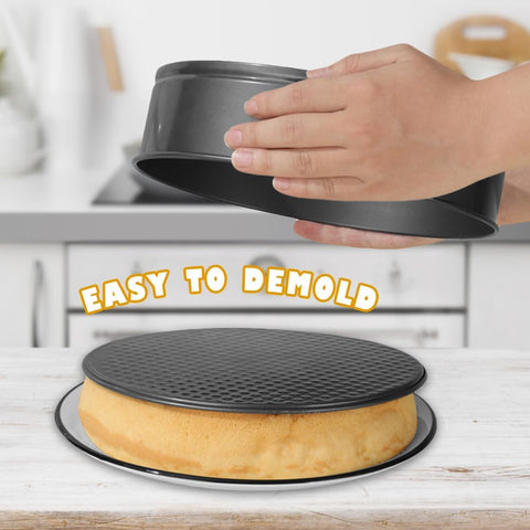 3-piece black non-stick springform pan set stacked
Close-up of leakproof buckle system and honeycomb base
Pan sizes and removable bottoms shown in open position
Full set displayed with baked cake example
Pans nested and stored compactly on kitchen counter