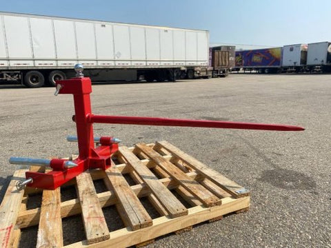 Red 3-point gooseneck hitch with bale spear mount
Tractor trailer hitch attachment with hay spear slots
Reinforced hitch frame for Conus 2 and Conus 1 spear placement
3-point trailer hitch attachment mounted on tractor
Spear holes and 2β trailer receiver on attachment frame