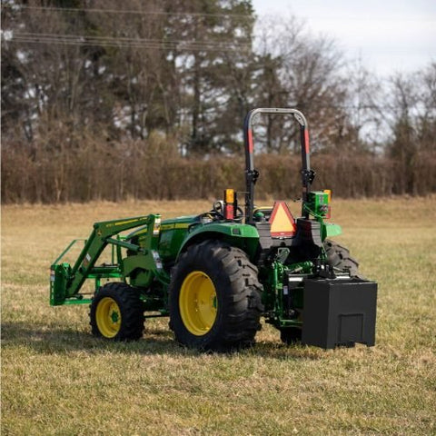Black ballast box attachment on tractor for rear counterweight
Close-up of Category 1 3-point hitch ballast box
Ballast box filled and mounted on tractor for stability
