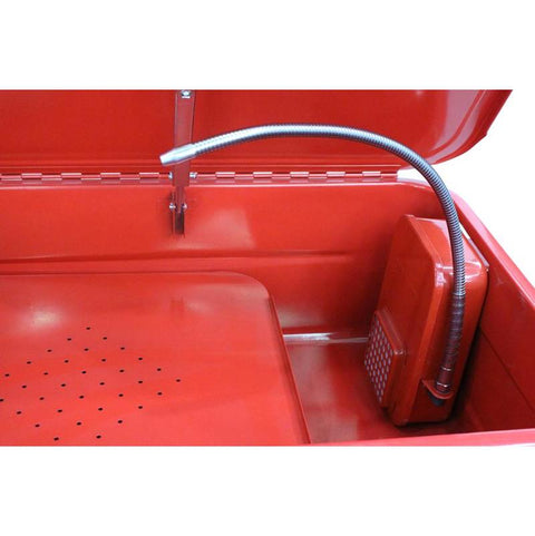 Close-up of solvent hose, filtration system, and basin interior of parts washer