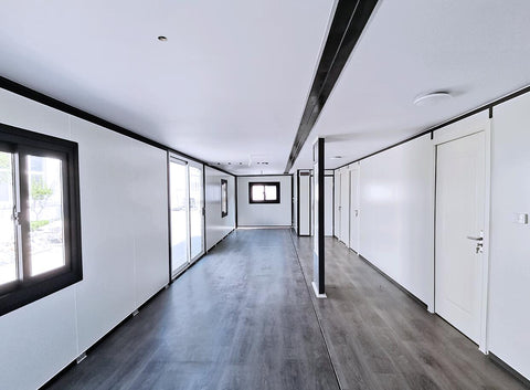 Open kitchen area with cabinets inside the modular container home