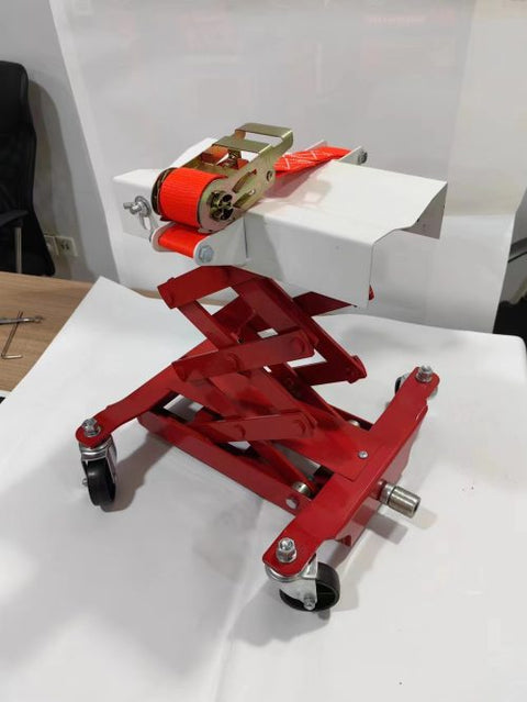 “450 lb red low lift transmission jack with swivel casters”
“Heavy-duty steel frame transmission jack under vehicle”
“Low-profile automotive transmission lift tool”