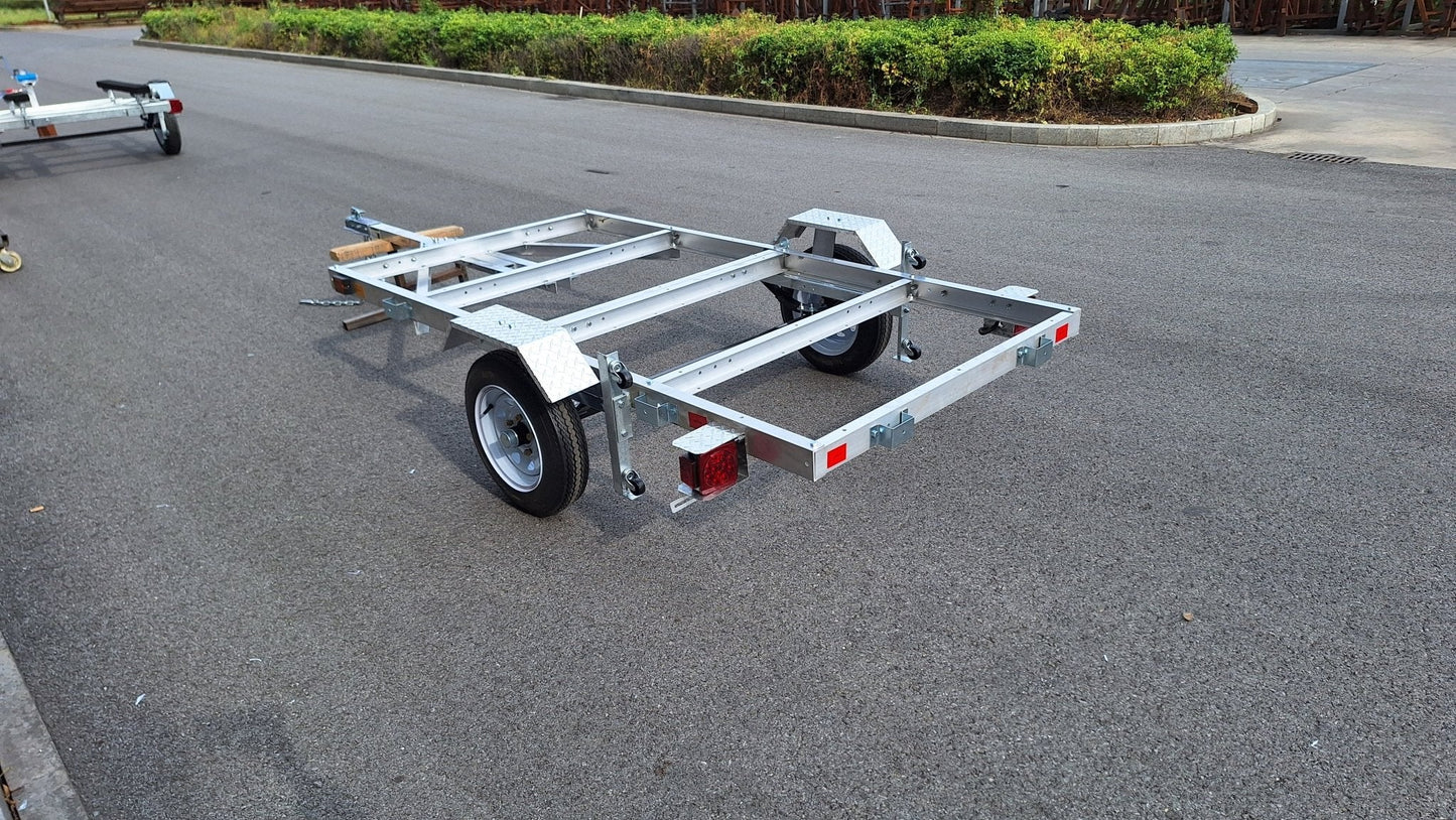"4x8 folding aluminum utility trailer with built-in casters"
"Space-saving lightweight trailer for small vehicle hauling"
"Compact aluminum trailer folded vertically for storage"
