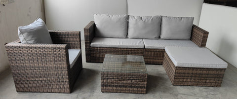 "5-piece L-shaped outdoor sectional with cushions and table"
"Modular patio furniture set in backyard setting"
"Gray cushioned patio sofa with glass coffee table"
"Weatherproof outdoor wicker sectional for patio"
"Durable resin wicker outdoor furniture with ottomans"