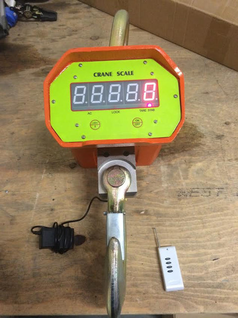 5 Ton Heavy-Duty Crane Scale with Digital Display – Yellow Model
10 Ton Crane Hanging Scale with LCD Display – Orange Model
Heavy-Duty Crane Scale with Remote Control in Use
Remote-Controlled Industrial Crane Scale – Front and Side View