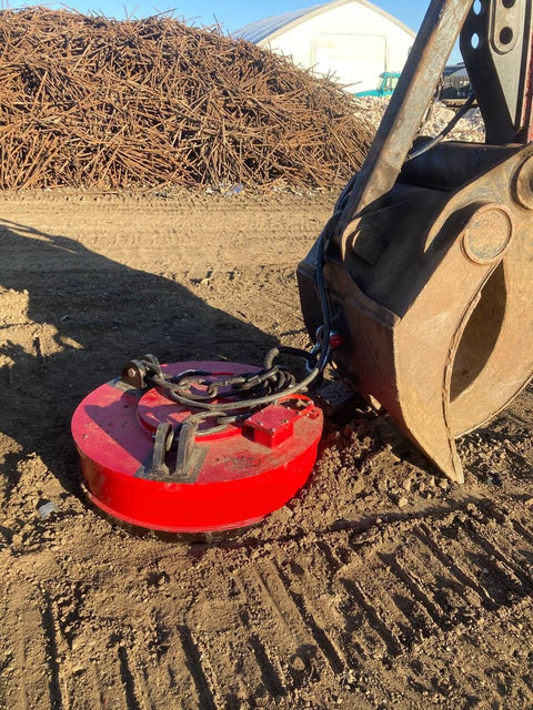 Red 50-inch excavator scrap lifting magnet with 230V connection
Heavy-duty metal separator magnet for demolition and recycling
Magnetic attachment for excavators handling ferrous scrap
