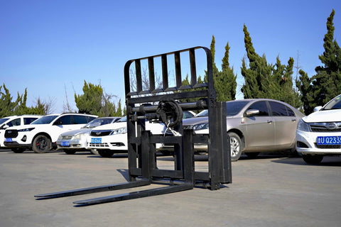 Side view of 5000 lb side shift pallet forks for skid steer
Heavy-duty hydraulic pallet fork with side shift mechanism
Pallet fork attachment mounted on forklift outdoors
Black steel frame skid steer pallet forks with side shift
Industrial pallet forks for warehouse and yard use