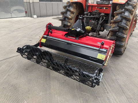 60” rotary stone burier tiller – 3-point hitch red attachment for tractors
Heavy-duty rock burying tiller with horizontal PTO offset system
Close-up of L-shaped blades and mesh roller on 60-inch tiller
PTO-driven stone burier tiller for compact tractors – SB165115