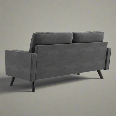 69.7-inch modern velvet sofa in navy blue with tufted back
Gray velvet upholstered sofa with pillows
Side view of modern green couch with wooden legs
Mid-century couch with tufted back and square arms