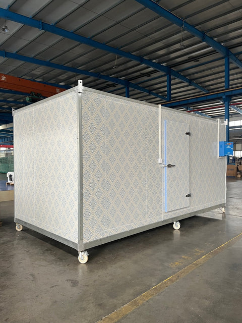 “Commercial walk-in freezer installed in warehouse”
“Modular cold room with open door and interior view”
“Flat-packed walk-in cooler components and hardware”
“Exterior view of insulated freezer unit panel walls”
“Walk-in chiller unit with digital controller and lockable door”