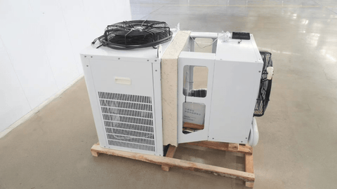 “Commercial walk-in freezer installed in warehouse”
“Modular cold room with open door and interior view”
“Flat-packed walk-in cooler components and hardware”
“Exterior view of insulated freezer unit panel walls”
“Walk-in chiller unit with digital controller and lockable door”