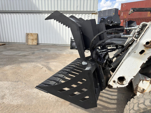 72" hydraulic grapple bucket on skid steer
Skid steer rock grapple front view
Close-up of grapple teeth and hoses
Dual-cylinder grapple open position
Grapple attachment lifting heavy debris