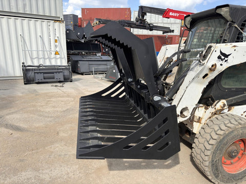72" hydraulic grapple bucket on skid steer
Skid steer rock grapple front view
Close-up of grapple teeth and hoses
Dual-cylinder grapple open position
Grapple attachment lifting heavy debris