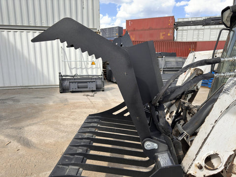 72" hydraulic grapple bucket on skid steer
Skid steer rock grapple front view
Close-up of grapple teeth and hoses
Dual-cylinder grapple open position
Grapple attachment lifting heavy debris