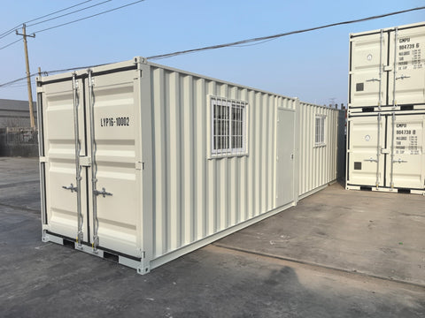 Gray 7FT steel office container with side door and windows
Interior view of 12FT jobsite office sea container
Office container unit with swing door and locking system
Plywood flooring inside portable office container
Security window with locking bar on steel sea container