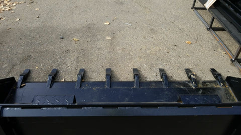 80" skid steer digging bucket with removable teeth
Heavy-duty bucket on job site with loader
Front view of 84-inch skid steer bucket
Skid steer digging into dirt with steel bucket
Wear strips and teeth close-up for material handling