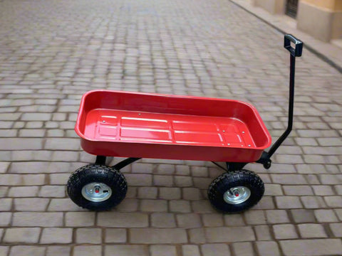 Red heavy-duty utility wagon shown on gravel with black handle