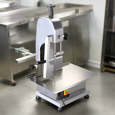 Full front view of a commercial frozen meat and bone saw machine
Side angle of a stainless steel cutting saw in a commercial kitchen
Bone saw machine in use, cutting frozen meat
Operator slicing frozen beef bones with an electric meat saw
Commercial food processing bone cutting equipment in operation
Close-up of adjustable blade on automatic bone saw