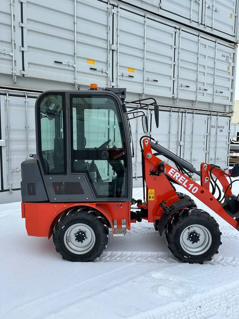 CanLift EREL10 electric wheel loader side view
Red electric wheel loader lifting materials
Bobcat-style quick hitch on CanLift loader
72V battery electric loader in warehouse
Heavy-duty compact loader with bucket attachment