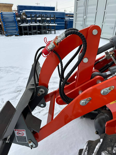 CanLift EREL10 electric wheel loader side view
Red electric wheel loader lifting materials
Bobcat-style quick hitch on CanLift loader
72V battery electric loader in warehouse
Heavy-duty compact loader with bucket attachment