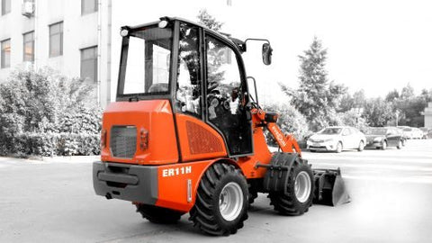 CanLift Mini Wheel Loader with Kubota D1703 engine, orange color – front view
Side view of CanLift compact loader with closed cabin and bucket raised
CanLift mini loader in operation – orange machine on construction site