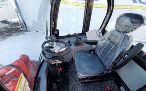 CanLift W12 Mini Wheel Loader with Kohler diesel engine outside a facility
Side view of CanLift W12 loader equipped with bucket attachment
Compact CanLift W12 Wheel Loader used on farm site