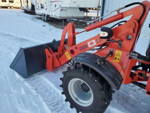 CanLift W12 Mini Wheel Loader with Kohler diesel engine outside a facility
Side view of CanLift W12 loader equipped with bucket attachment
Compact CanLift W12 Wheel Loader used on farm site