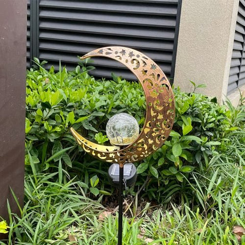Crescent moon shaped solar LED light for garden pathway
Warm white crackle glass orb on solar-powered metal stand
Outdoor crescent moon decor light with solar panel
Elegant crackle glass garden light at night glowing warm white
Solar crescent garden light illuminating flower bed