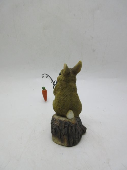 Hand-painted resin carrot fishing bunny garden statue
Whimsical outdoor bunny figurine with carrot pole
Close-up of resin bunny fishing statue for garden décor