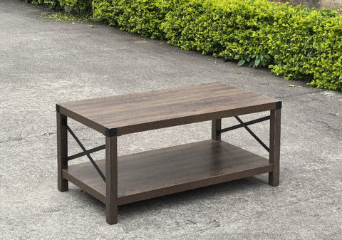 Gray wash rustic coffee table with metal X-frame in the living room
Front view of the coffee table showing shelf storage
Side angle showing gray tabletop and open shelf
Coffee table outdoors with accessories
Detail of gray wash wood and black frame