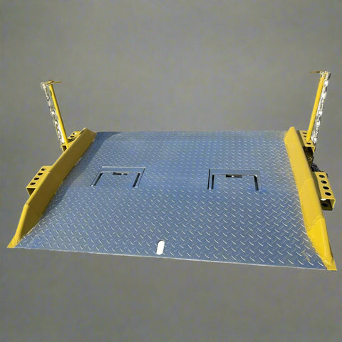 Heavy-duty steel loading dock ramp on warehouse floor
Industrial dock ramp with yellow safety rails
Forklift-ready steel dock board in use
Side view of 15,000 lb steel dock ramp
Loading dock ramp with chain attachment system